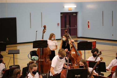 Orchestra students prepare to play